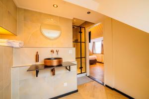 a bathroom with a sink and a mirror at Hotel Buren in Buren +33 photos