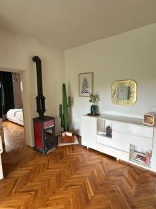 a living room with a wood burning stove in it at Villa Saranda in Supetarska Draga