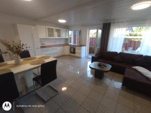 a living room with a couch and a table at Ferienwohnung Fuchsbau in Werne an der Lippe