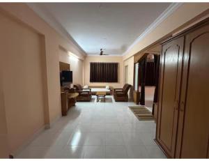 a hallway of a hotel with a living room at Hotel shree darshan Dwarka in Dwarka +16 photos
