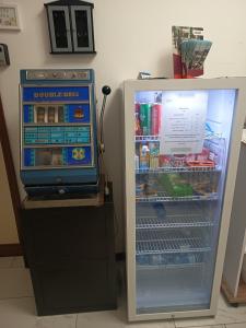 a refrigerator that is open with food inside at VillaGioveRooms in Prato