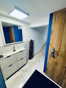 a bathroom with a sink and a mirror at Agro Bieszczady 2 in Czarna +49 photos