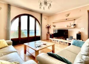 a living room with two couches and a table at Apartments La Perla in Mlini