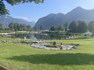 a view of a lake with mountains in the background at MAVI Apartment in Schlitters