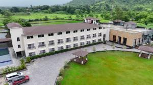 an overhead view of a building with a car parked in front at Estrella The Resort in Karjat