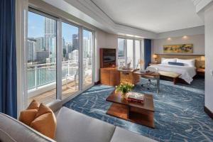 a hotel room with a bed and a large window at Mandarin Oriental Miami in Miami +149 photos