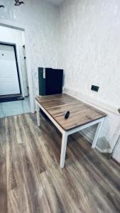 a wooden table sitting on top of a room at ЖК Табигат in Borovoye