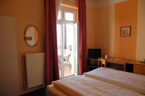 Postel nebo postele na pokoji v ubytování Hotel Graf Pückler