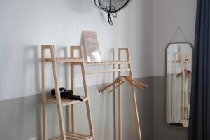 a room with two wooden shelves and a mirror at LaBo Homestay in Quan Lạn