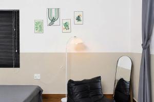 a bedroom with a bed and a mirror and a lamp at LaBo Homestay in Quan Lạn