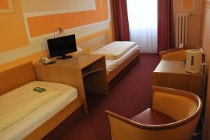 Postel nebo postele na pokoji v ubytování Hotel Graf Pückler