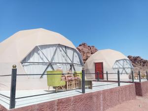 a couple of domes with food inside of it at Wadi Rum Panorama Suites in Disah