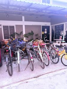 a group of bikes parked in front of a building at Pion Hotel Ayutthaya in Phra Nakhon Si Ayutthaya