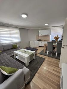 a living room with a couch and a table at Deluxe apartment Amar in Sarajevo