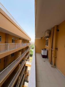 an empty hallway of a building with a balcony at Bright & Modern 1BHK in Ghaziabad
