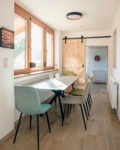 a dining room with a large table and chairs at Három Sziget Vendégház in Dunasziget +13 photos