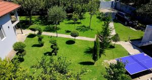 an aerial view of a garden with trees and a solar panel at Hidden Oasis PeSa - Luxury Villa with Pool & Spa in Podgorica