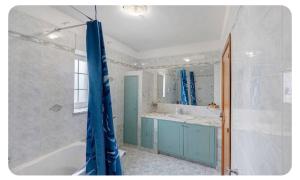 a bathroom with a tub and a sink at Camera dell' antico Arco Romano in Pozzuoli +27 photos