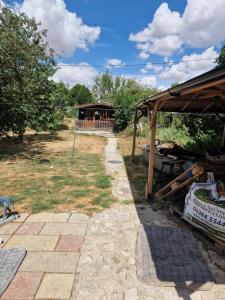 a garden with a house in the background at The Cabin - a very quiet location in Pewsey