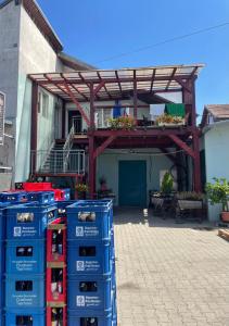 a building with a pergola and some boxes at Cazare Turnisor in Sibiu