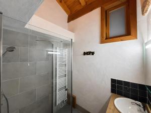 a bathroom with a shower and a sink at Les Dolomites in La Plagne Tarentaise +23 photos