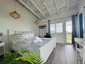 a bedroom with a large bed in a room at La Jamaca - An Island Vibe Hotel in La Parguera +163 photos