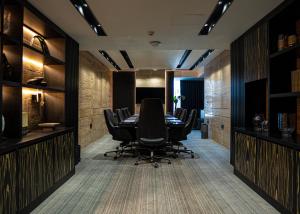 a conference room with a table and chairs at The V Hotel in Baghdād