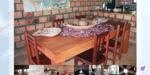 a wooden table with two bowls on top of it at Mahale Resort - Casa 1 in Jangamo