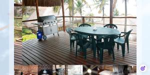 a deck with a table and chairs and a grill at Mahale Resort - Casa 1 in Jangamo