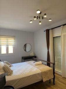 a bedroom with a large bed and a window at Exclusive Villa with Pool in Káto Ássos +22 photos