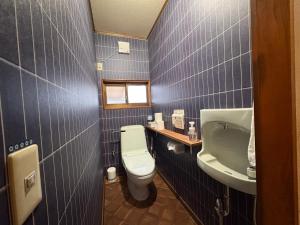 a bathroom with a toilet and a sink at Haraya in Nakatsugawa +36 photos
