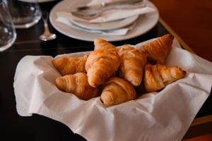 a plate of croissants on a table at Chalet Santo António in Sintra +27 photos
