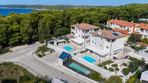 an aerial view of a house with a swimming pool at Villas Marisol in Premantura