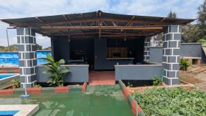 a view of a house with a pergola at The Serene Maskani in Moshi +7 photos