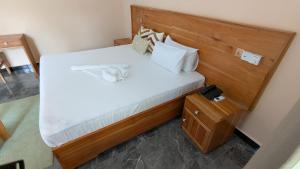 a bedroom with a bed with a stuffed animal on it at The Serene Maskani in Moshi
