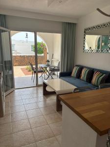 a living room with a couch and a table at 42 Guacimeta Club in Los Pocillos