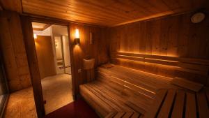 an empty wooden sauna with a bench in it at Hotel Residenz in Ravensburg
