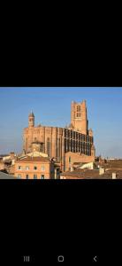 a large castle sitting on top of a building at Tour Médiévale Unesco in Albi +9 photos