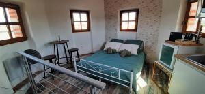 a bedroom with a bed in a room with a table at Tour Médiévale Unesco in Albi