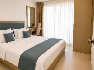 a bedroom with a large bed in a room at Beachfront Sky Studio with Ocean View in Wattala +76 photos