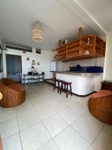 a kitchen with a table and chairs in a room at BlackPoint in Ballenita