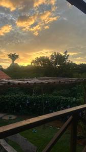 a view of the sunset from the balcony of a house at Chácara Encanto do Horizonte in Ibiapina +4 photos