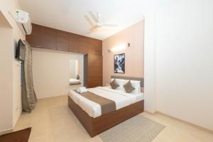 a bedroom with a large bed in a room at viyan stays in Coimbatore