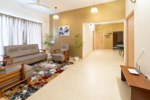 a living room with a couch and a table at viyan stays in Coimbatore