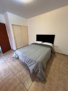 a bedroom with a large bed in a room at Depto Rafaela in Rafaela
