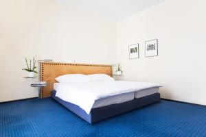 Postelja oz. postelje v sobi nastanitve GLANDON Rooms Elite