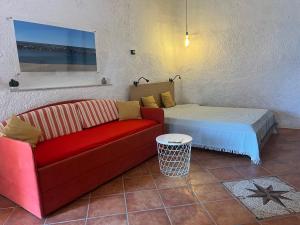 a living room with a couch and a table at Olivetta House Holiday in Moneglia +13 photos