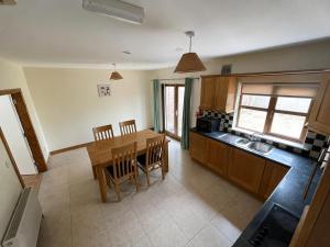 an overhead view of a kitchen with a table and chairs at 28 Rathevan View Rosdarragh Portlaoise in Portlaoise +9 photos