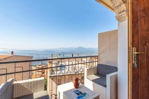 a balcony with a view of the ocean at Casa Bellavista in Baunei