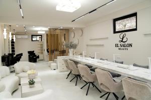 a salon with a long table and chairs at EL hotel in Kutaisi